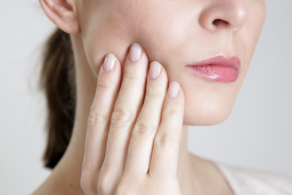 Close up of a woman with dental trauma at Surf City Oral and Maxillofacial Surgery in Huntington Beach, CA